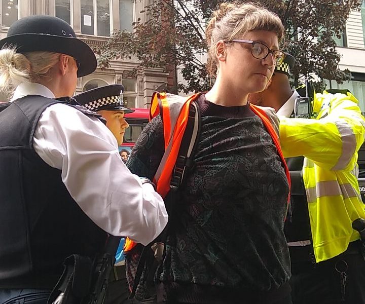 Emma Ireland is handcuffed at the protest in New Oxford Street