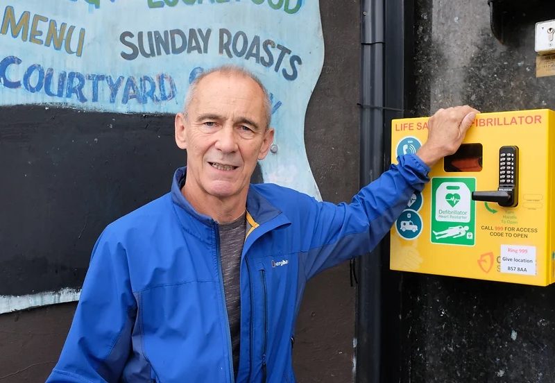 Simon Brookes with one of the many defibrillators he has raised funds to install in his efforts to develop a network of the devices across Bristol