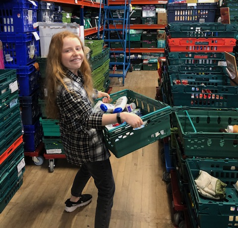 Luna, 12, hard at work at the Bristol North West Foodbank